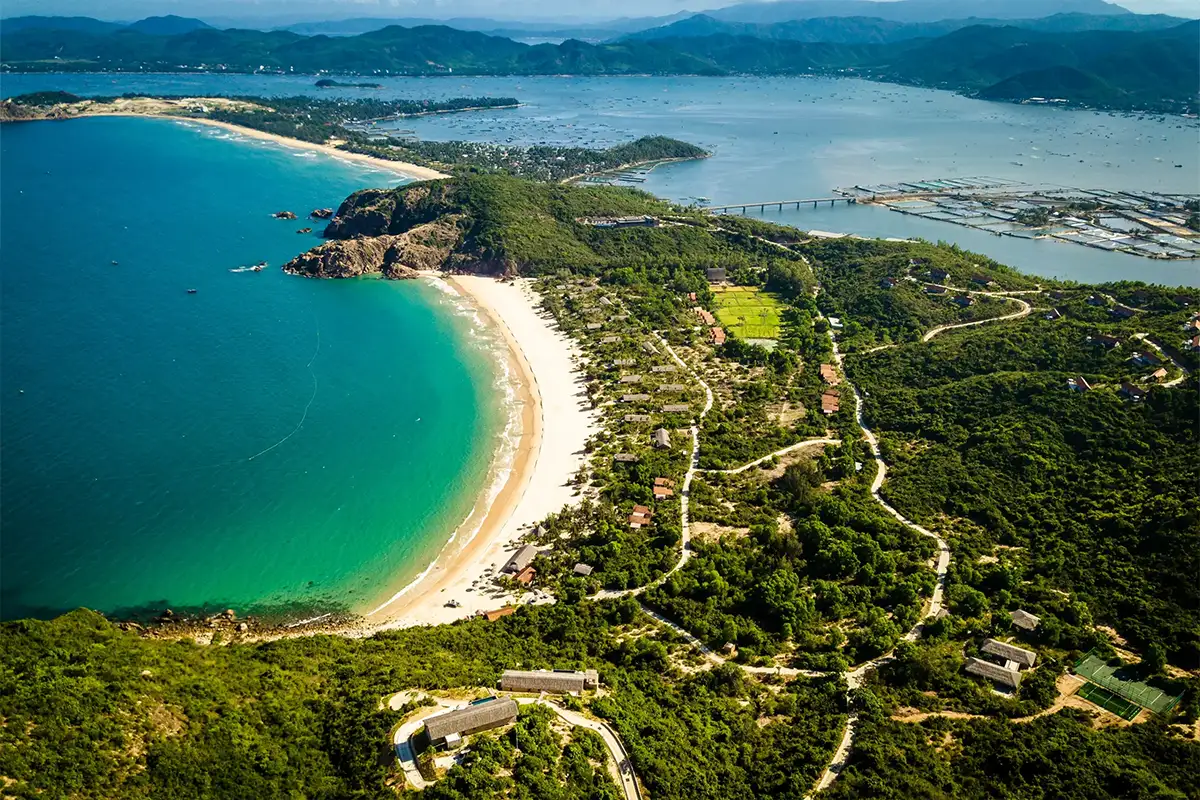 Zannier Bãi San Hô, Dak Lak, VIetnam - Drone view showing the resort, the bay and the fisherman village in the background