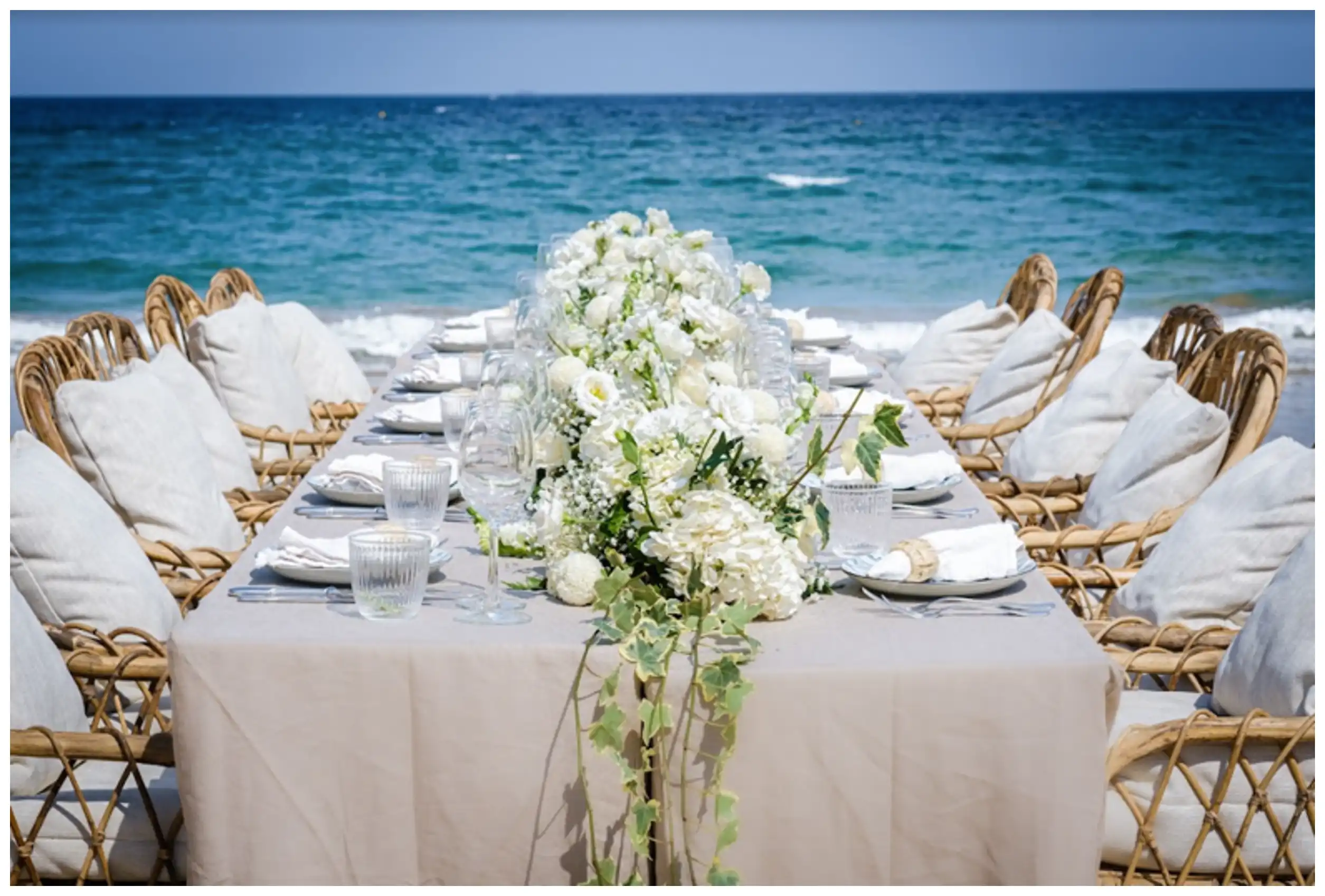 Table dressed for a wedding celebration by the sea at Zannier Bãi San Hô, Vietnam.