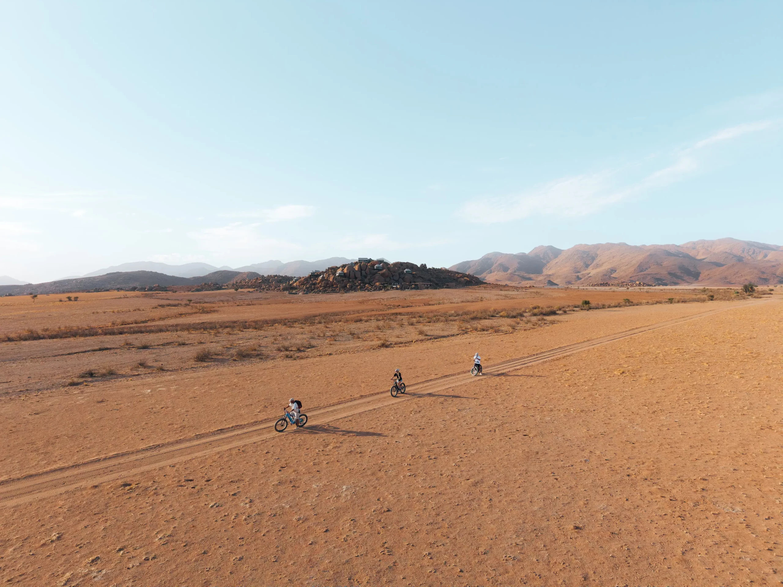 Zannier Sonop, Hardap, Namibia - Cyclists on an electric fat bike trail in the Namib Dessert